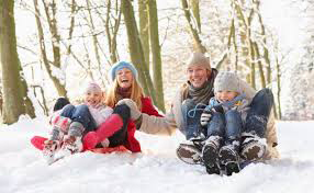 Family playing in a snow