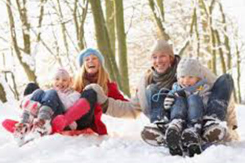 Family playing in a snow